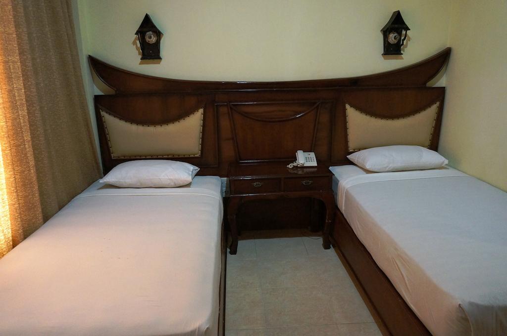 Edotel Minangkabau Padang  Habitación foto
